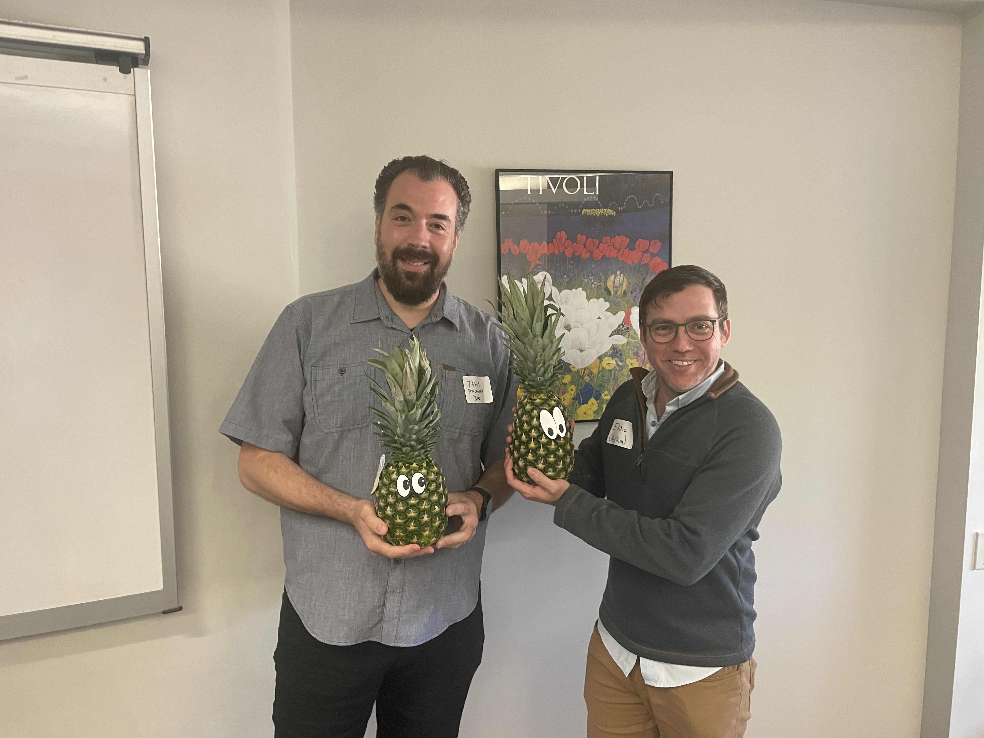 Faculty members Pothitos Pitychoutis and Eddie Glayzer pose with pineapples to signify their graduation from ATLS.